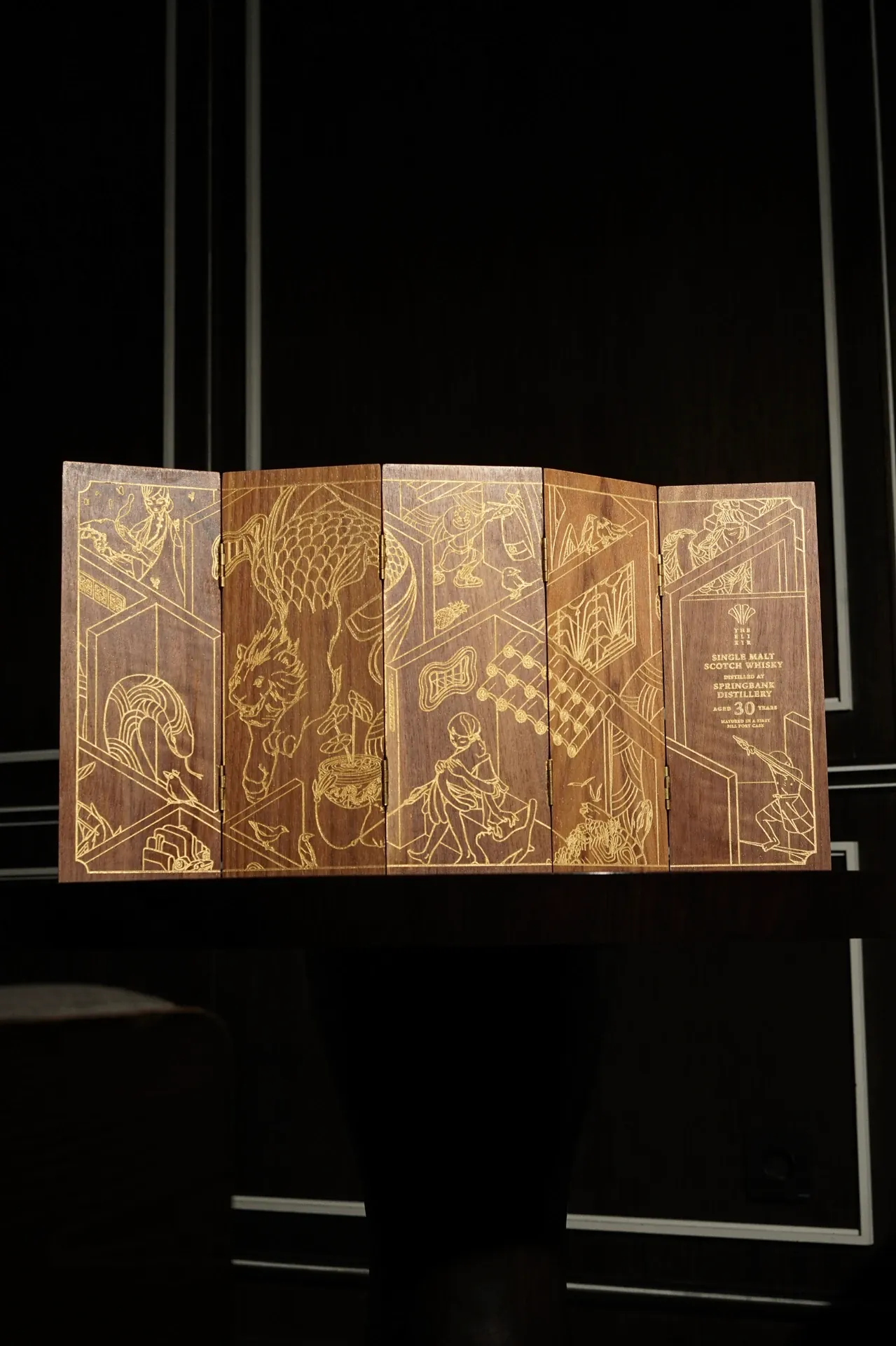 Gold engraved wooden display case from The Store
